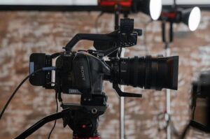 Film production crew filming a documentary in Malawi with local fixer and camera equipment