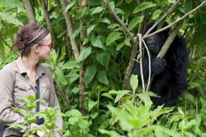Pregnant traveller enjoying a relaxed wildlife safari from a vehicle in Uganda