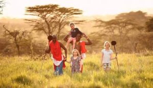 Family safari in Kenya watching elephants and wildlife on the African savannah