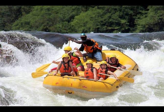 Tourists enjoying a scenic boat cruise on the River Nile in Uganda