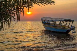 Tourists exploring Lake Victoria in Uganda on a scenic boat excursion