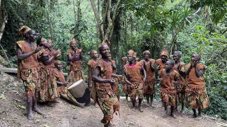 Batwa community members sharing traditional music and cultural heritage near Bwindi Impenetrable National Park, Uganda